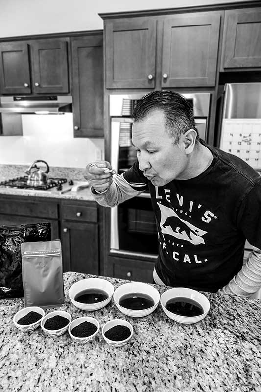 man tasting coffee sample